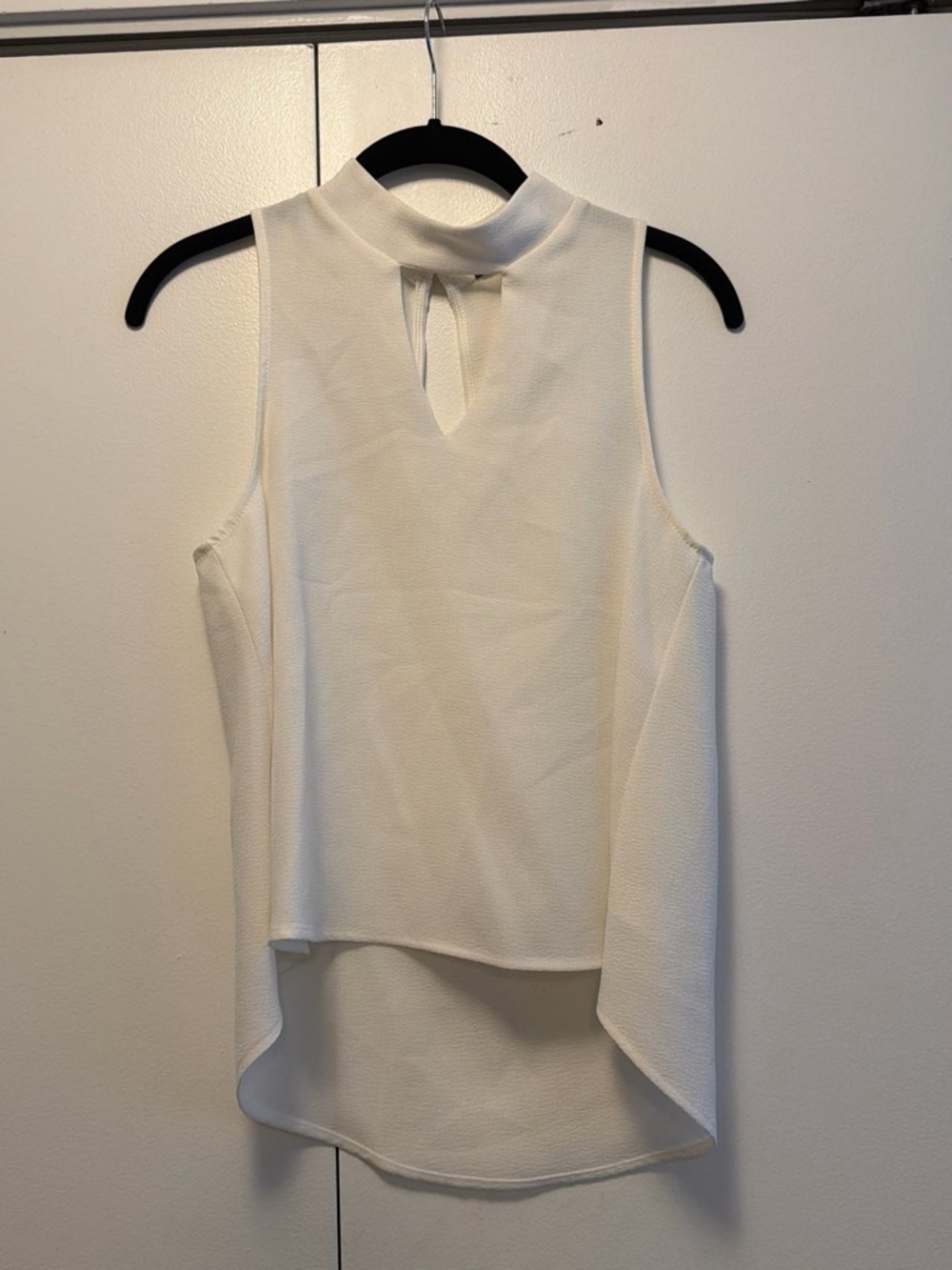 Sleeveless Cream High-Neck Blouse